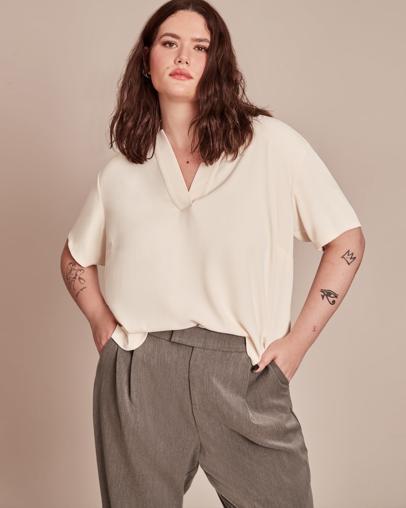 Front of a model wearing a size 12 Hayley Blouse in WHITE by 11 Honoré Collection. | dia_product_style_image_id:224080